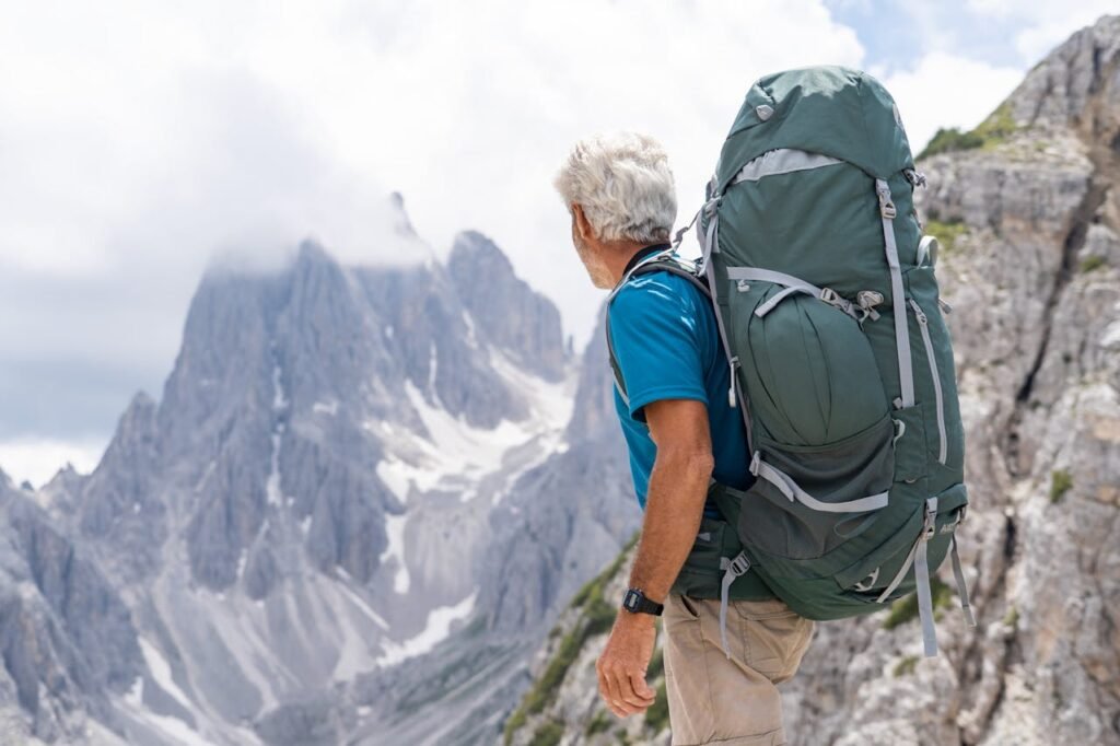pexels photo 20446154 Senior man with backpack hiking through the stunning Dolomites in Italy, enjoying the adventure.